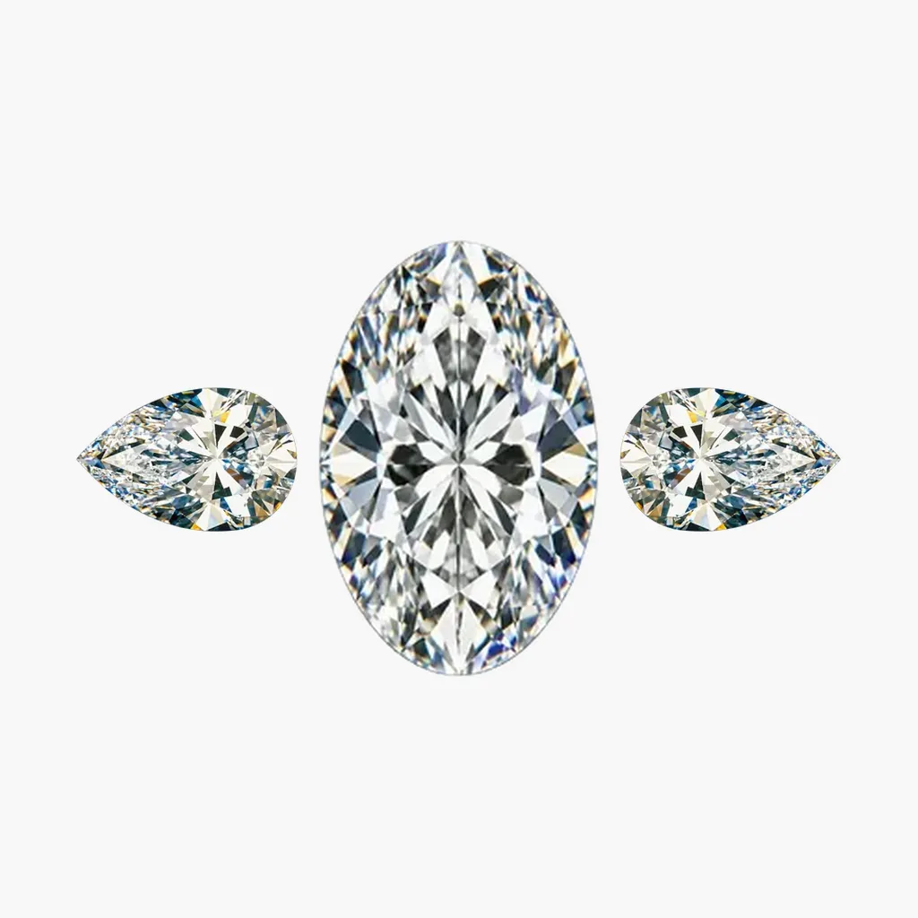 Oval diamond engagement ring design with two pear cut side diamonds
