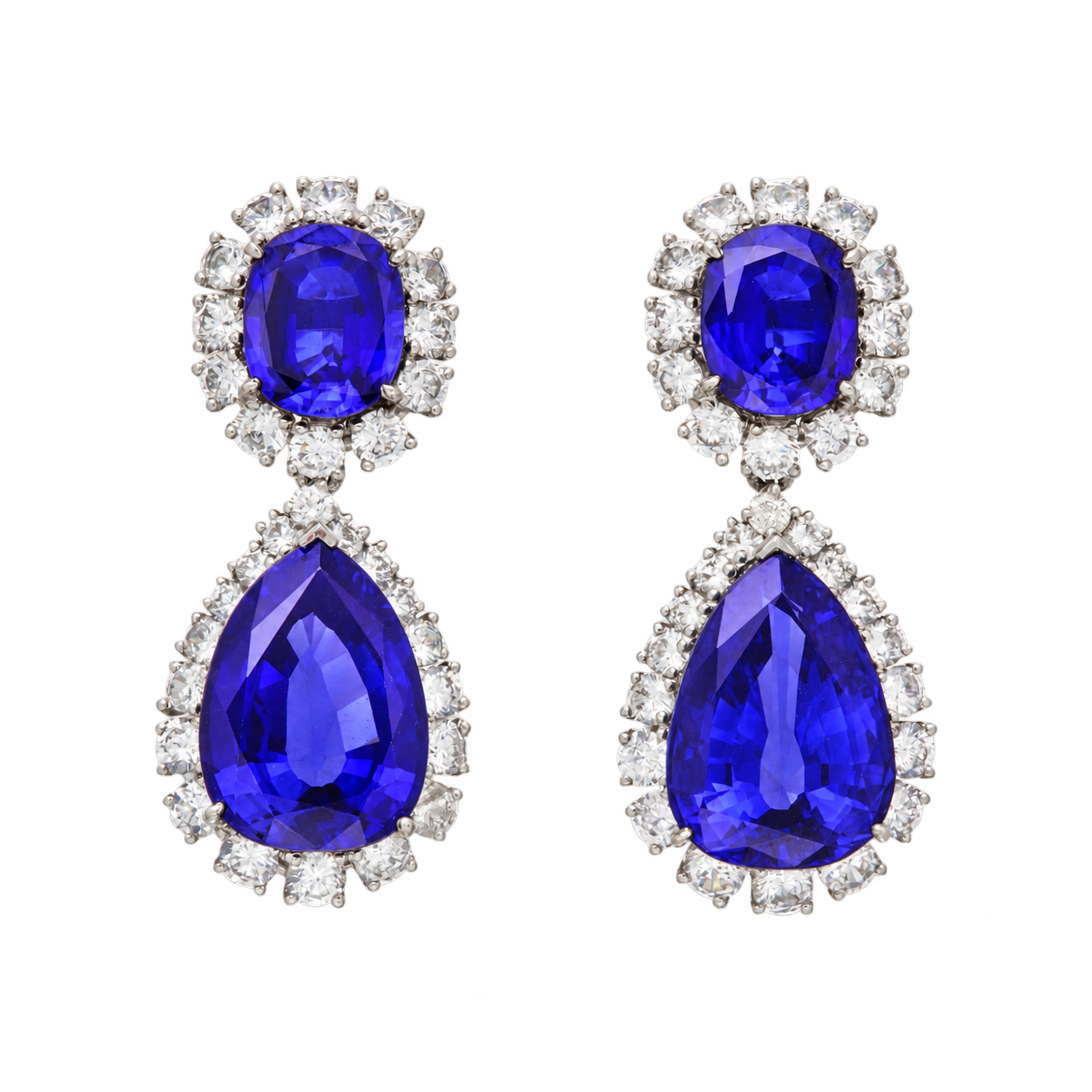 Violet-blue tanzanite drop earrings with oval and pear-cut stones in diamond halos, set in platinum
