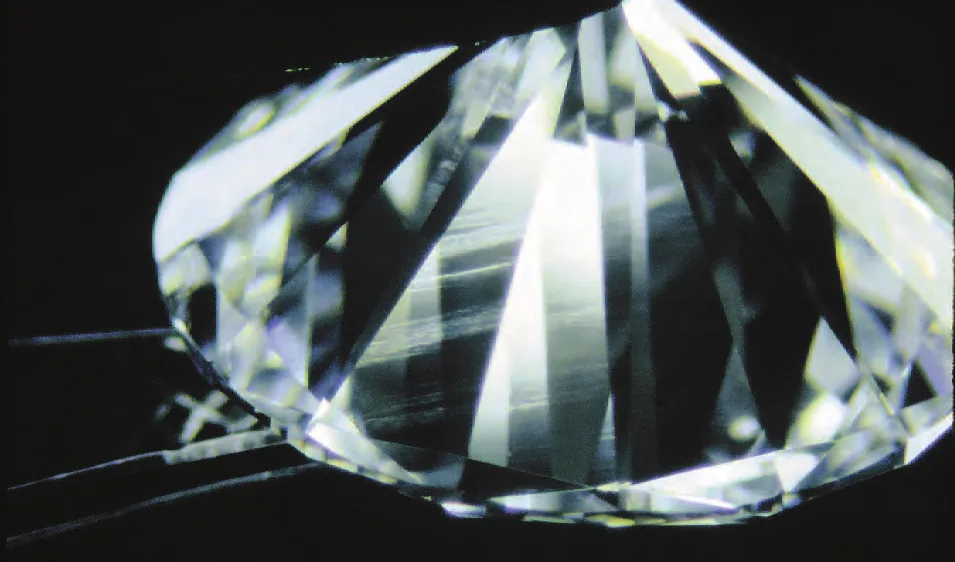 Round brilliant diamond lit from the side, showing brilliance and fire